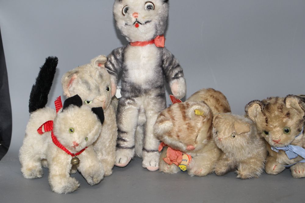 A group of assorted vintage soft toy cats including Steiff